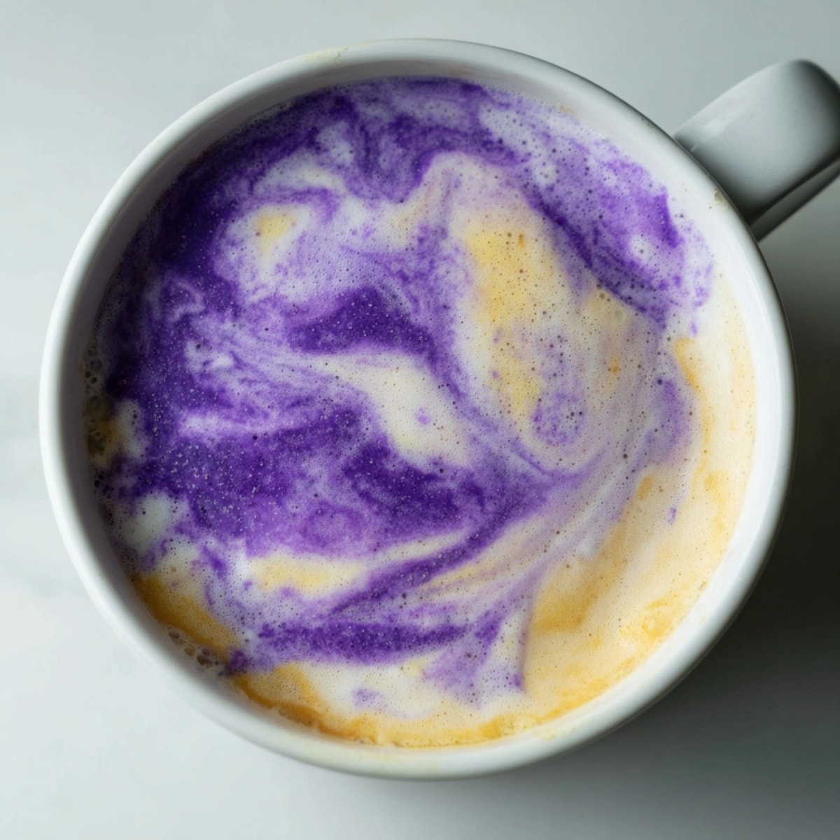 Ube Latte, a vibrant purple drink, freshly prepared with sweet, nutty ube halaya.