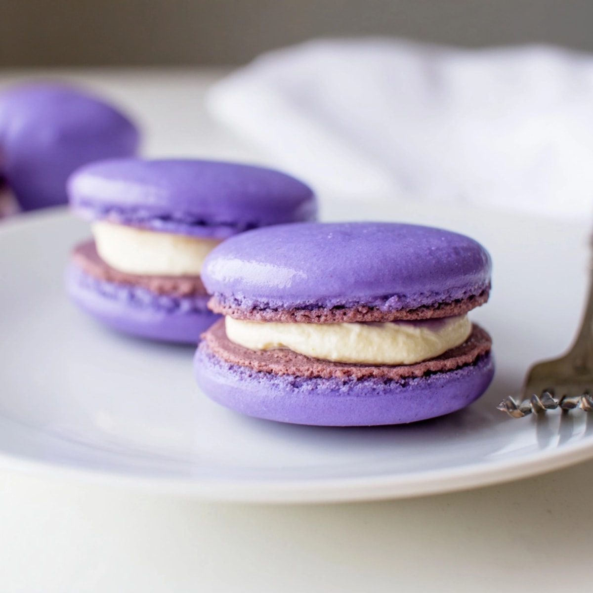 Step-by-step guide to making perfect, delicious, purple hued French Ube Macarons.
