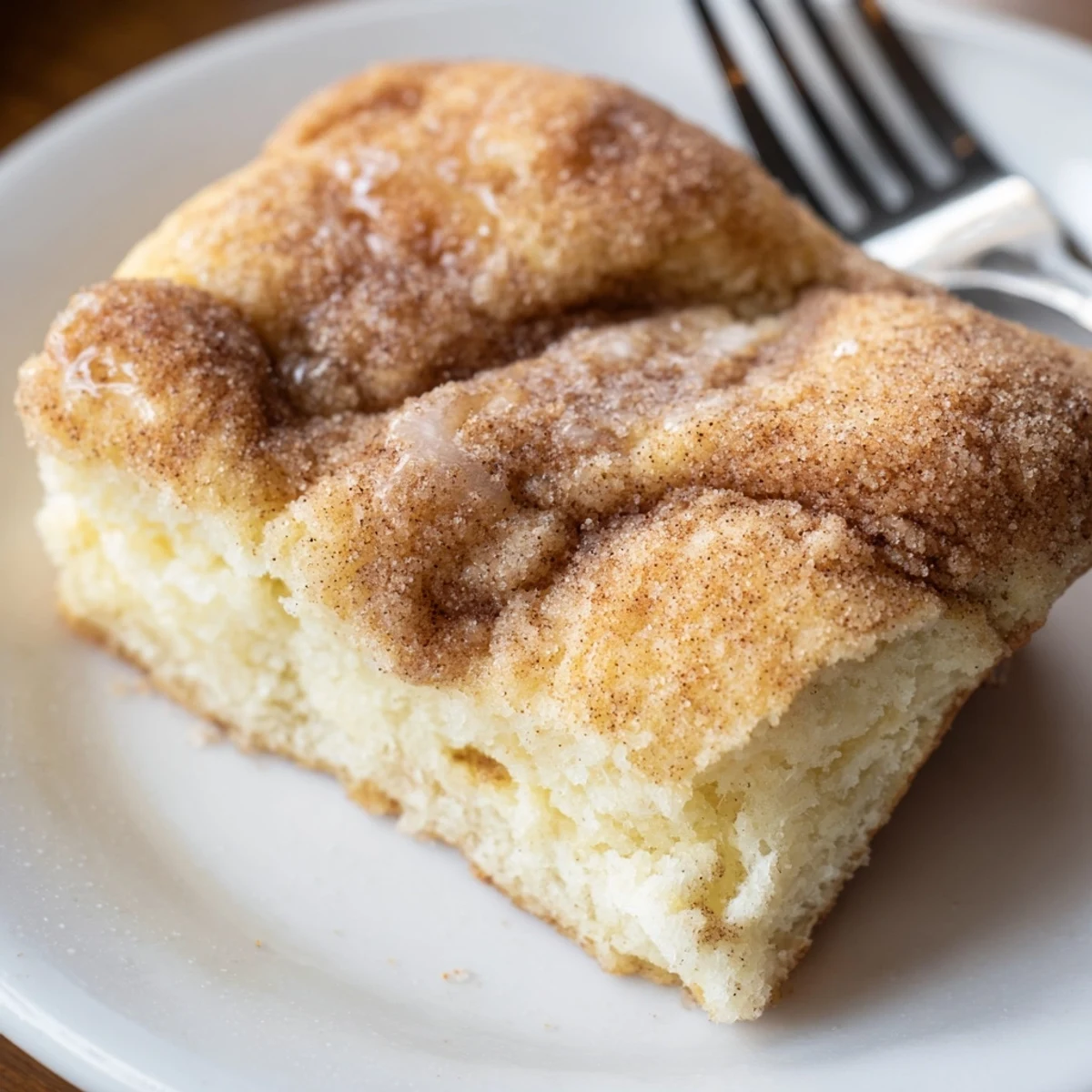 Warm Sweet Cinnamon-Sugar Focaccia, a treat with a soft interior and cinnamon-sugar topping, perfect for brunch.