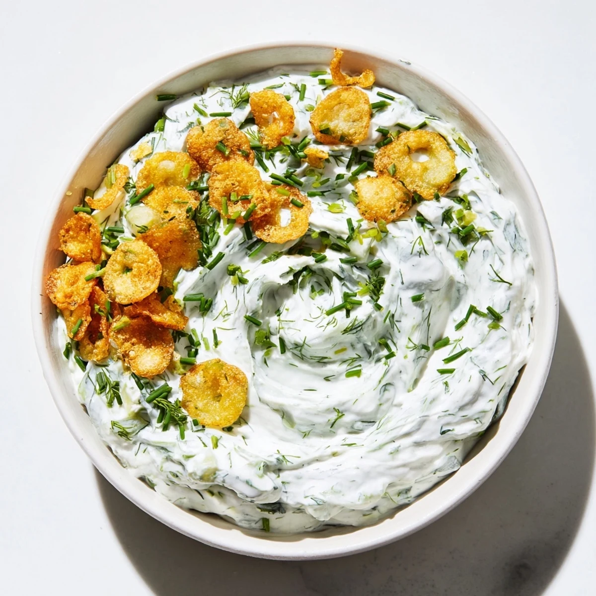 Crispy fried pickles and fresh dill dip, a perfect appetizer for any gathering.