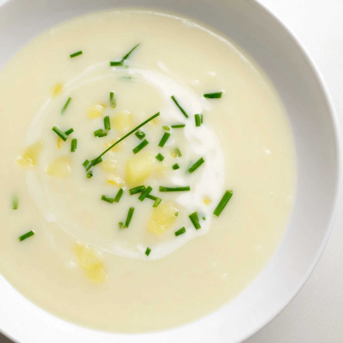 A smooth, velvety blend: homemade Leek and Potato Soup perfect for a cozy dinner.