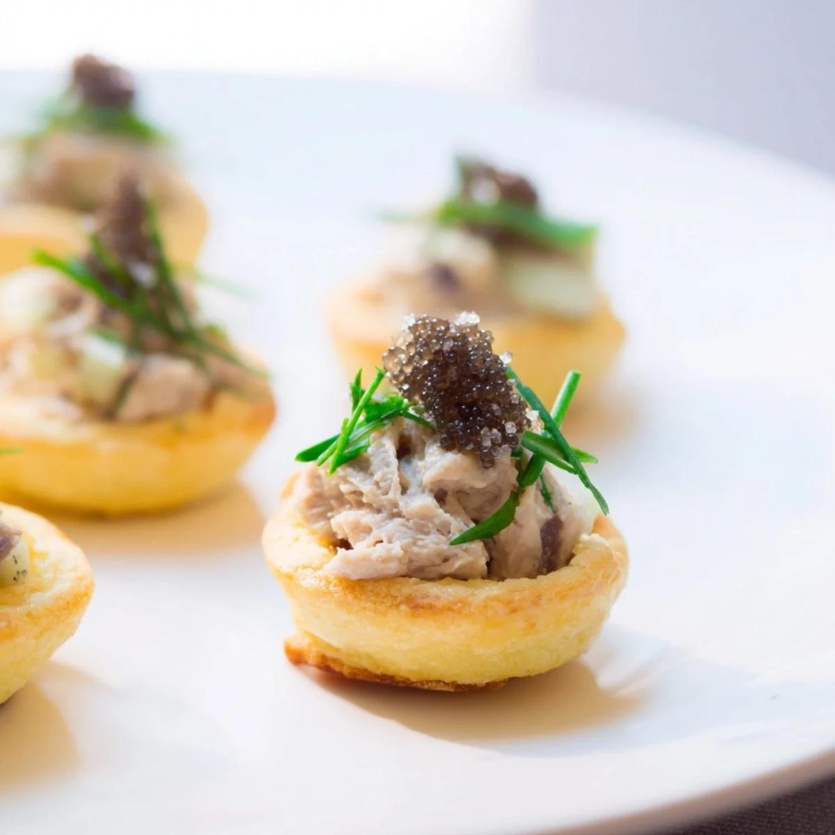 Lightened Foie Gras Pâté Cups filled with silky pâté, elegant garnish, ideal for a refined appetizer.