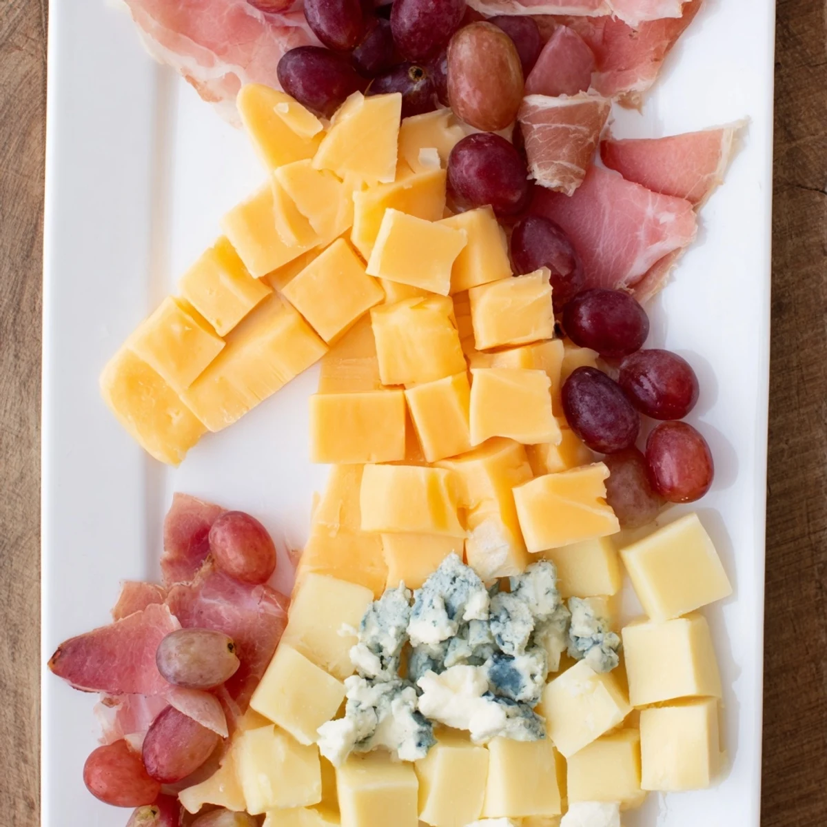 A striking Horse-Shaped Grazing Board brimming with cheeses, meats, fruits, and crackers for a fun party.