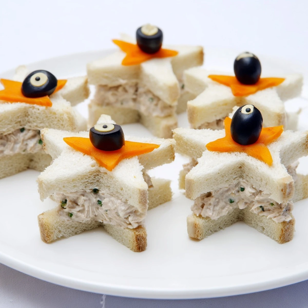 Mini Starfish Sandwiches shaped decoratively, ready to enjoy at a children's party or gathering.
