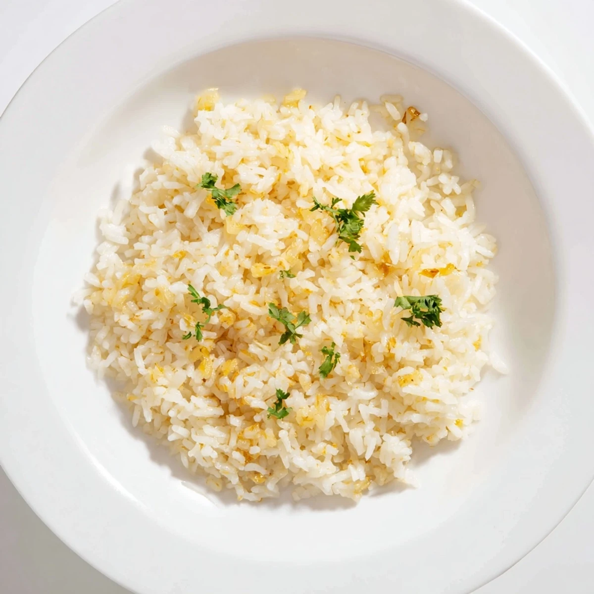 Steaming bowl of Jasmine Rice Garlic, a flavorful vegan side dish, ready to serve warm.