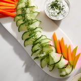 Fresh Veggie Platter with a fan shape and a cool, creamy dipping sauce, perfect for a refreshing party snack.