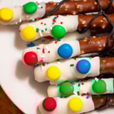 Fun no-bake snack: Pretzel sticks decorated as Christmas lights, a colorful and delicious treat.