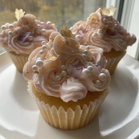 Mini Cherry-Vanilla Cupcakes with Rococo Frosting, exquisitely decorated, ready for an afternoon party, are picture-perfect.