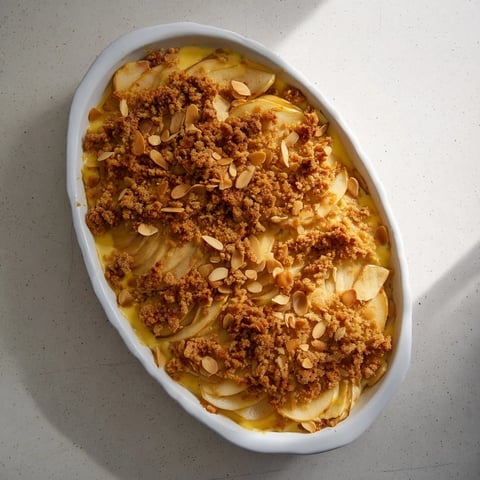 Golden-topped quick chestnut and pear gratin, a warm dessert with sliced pears and chopped chestnuts.