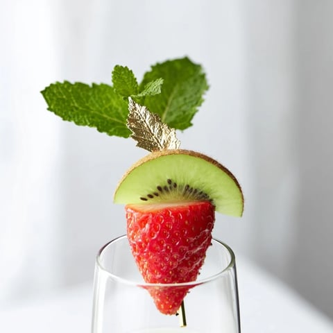 Vibrant champagne flute fruit garnishes for New Years, offering a colorful and festive display.