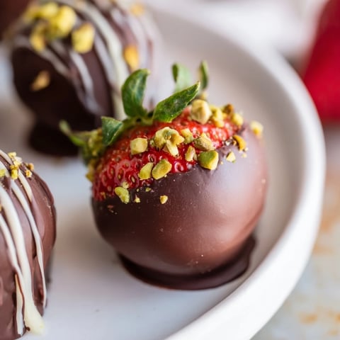 A decadent photo showcases fresh Dark Chocolate Covered Strawberry Dips, ready to be enjoyed.