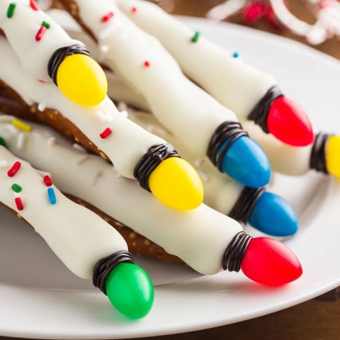 Festive pretzel sticks and dip Christmas lights displayed, colorful and ready for a holiday snack.