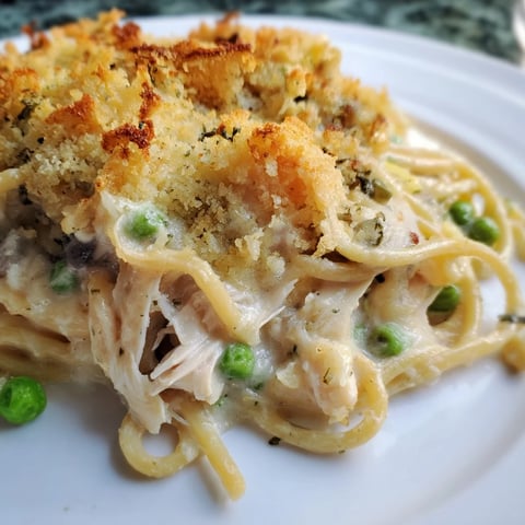 Tender turkey tetrazzini bake with golden crust, a delightful creamy pasta comfort food.