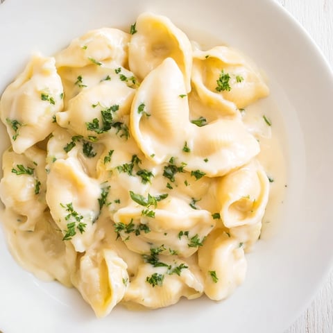 High-protein mac & cheese, a close-up of creamy, cheesy pasta in a bowl.
