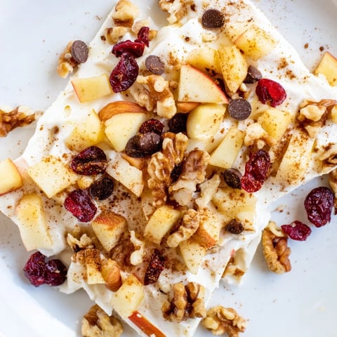 Apple Cinnamon Yogurt Bark topped with crisp apples, ready to be broken into delicious pieces.