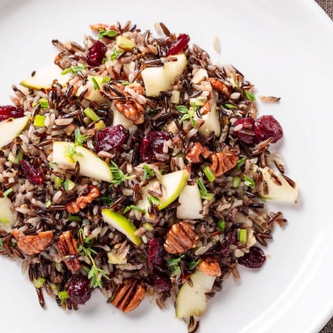 A hearty bowl with wild rice harvest salad, studded with cranberries and toasted pecans.