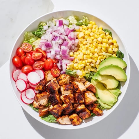 A vibrant Roasted Corn & Chicken Chopped Salad, showing off grilled corn and tender chicken pieces.
