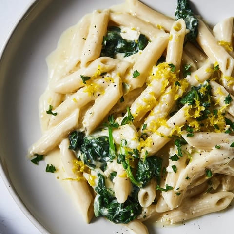 Creamy Feta Spinach Pasta: a close-up of pasta tossed with spinach and creamy feta cheese.