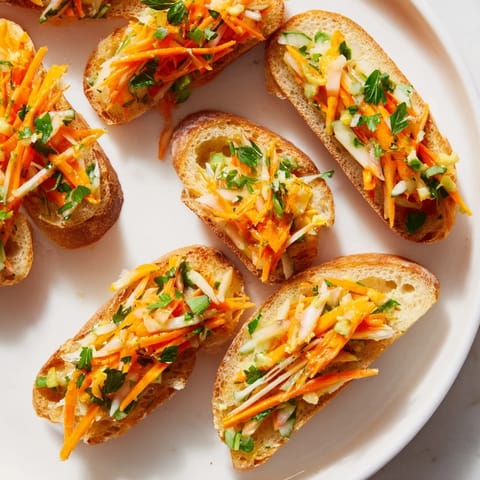 Tangy cornichon and carrot slaw elegantly served on toasted baguette appetizers.  