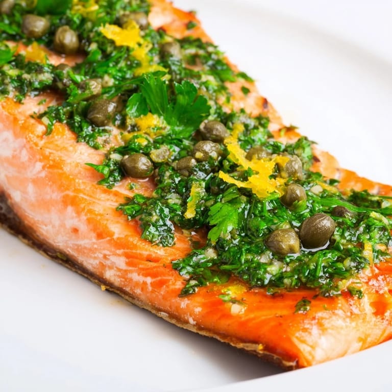 Juicy salmon and tender roasted vegetables shine under a bright parsley dressing, served hot for an easy, healthy dinner.